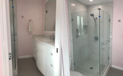 shower with pink walls and vanity